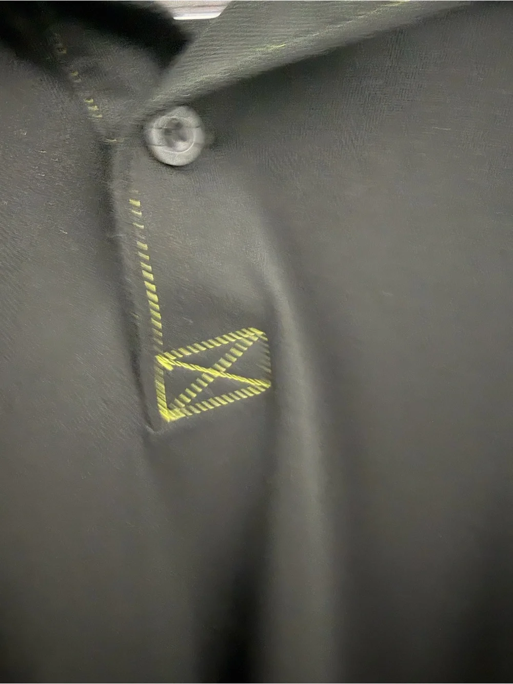 Lacoste Black Polo with Blue Panels and Green Accents